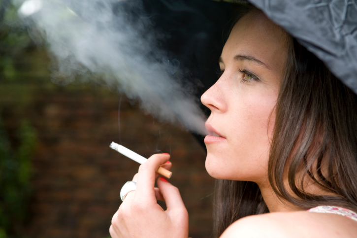 Teen smoking a cigarette.